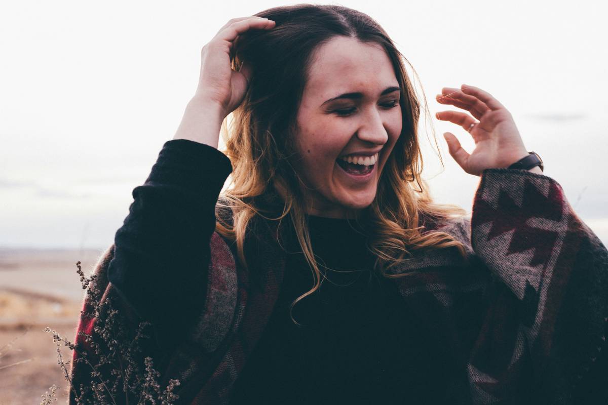 Success story featuring someone smiling with a cup of lemon balm tea